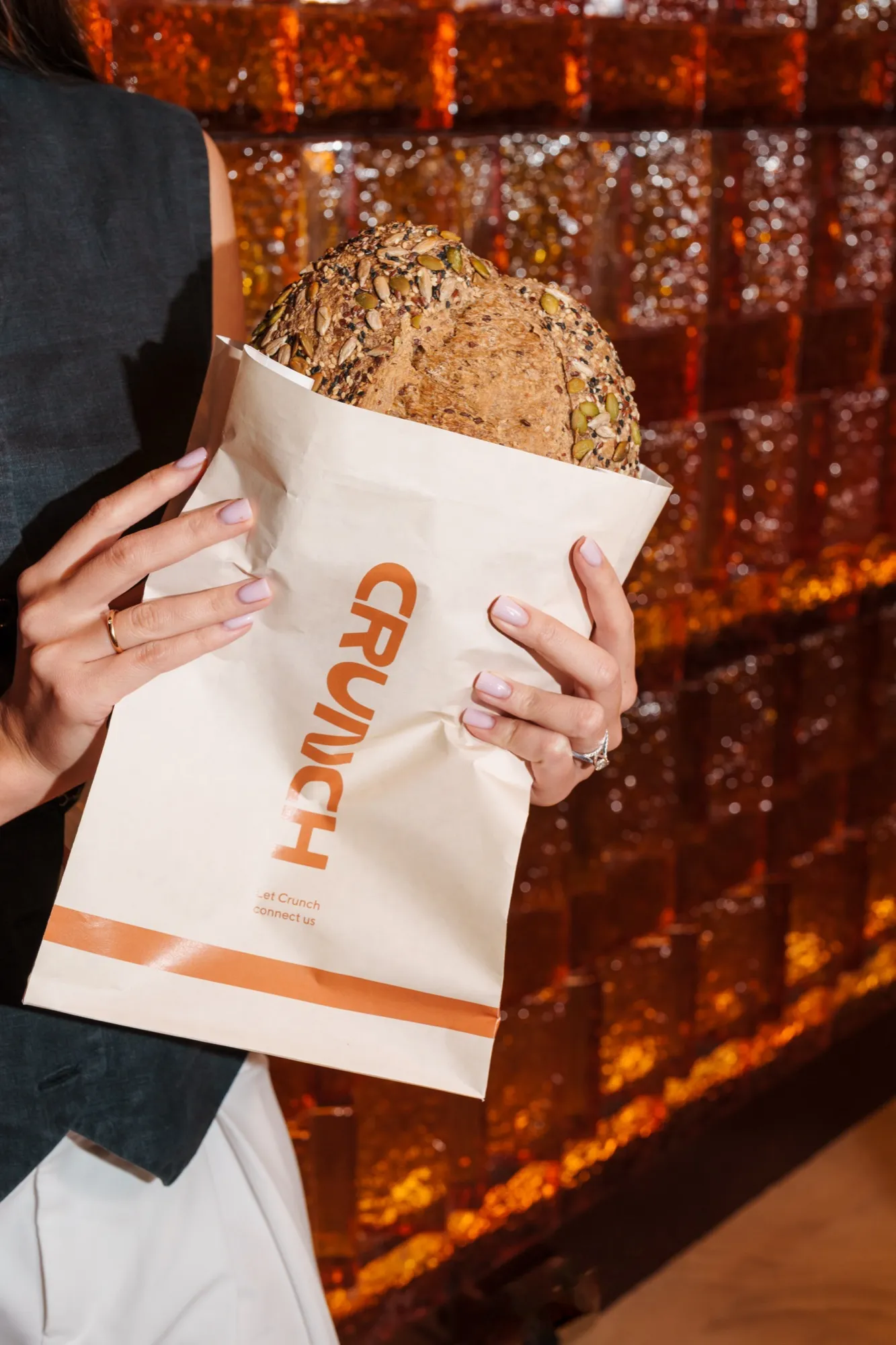 Seeded sourdough loaf in a CRUNCH paper bag